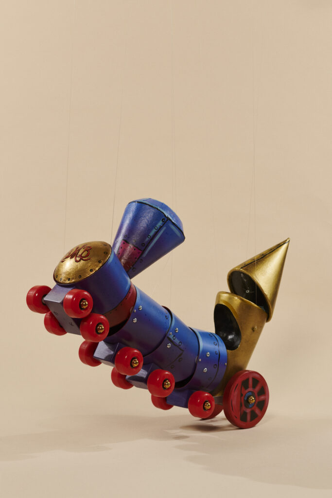 A photo of a train puppet.