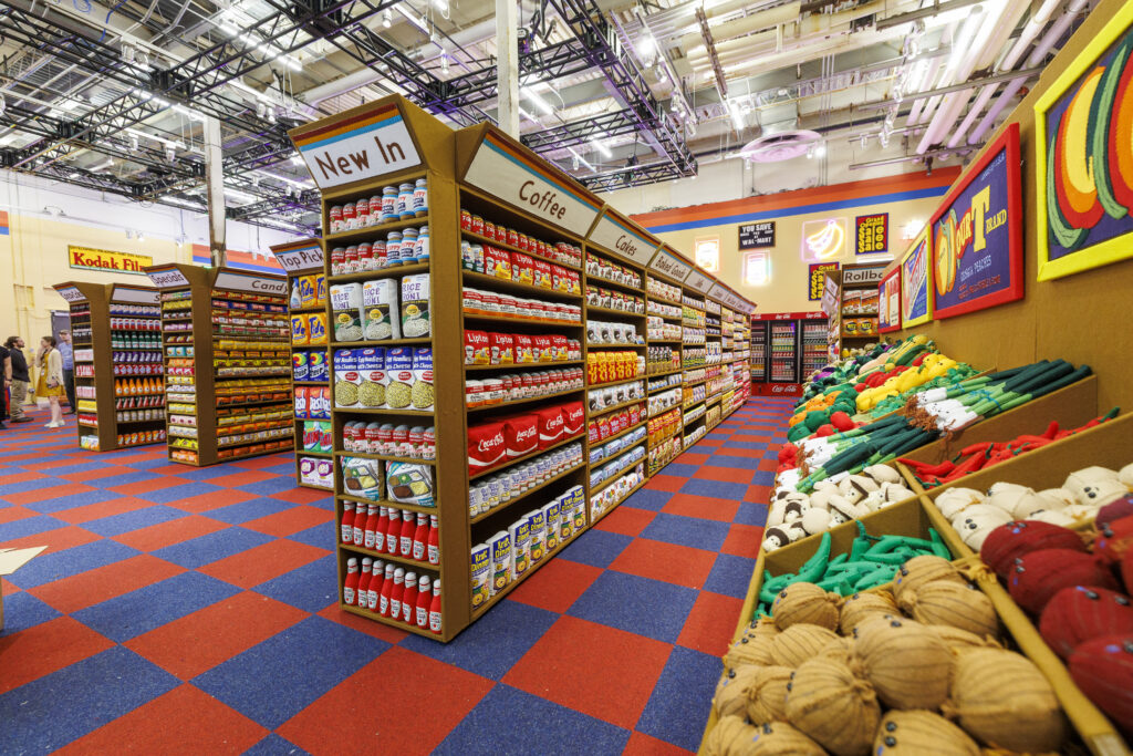A photo of an art installation of a supermarket where everything is made of felt.